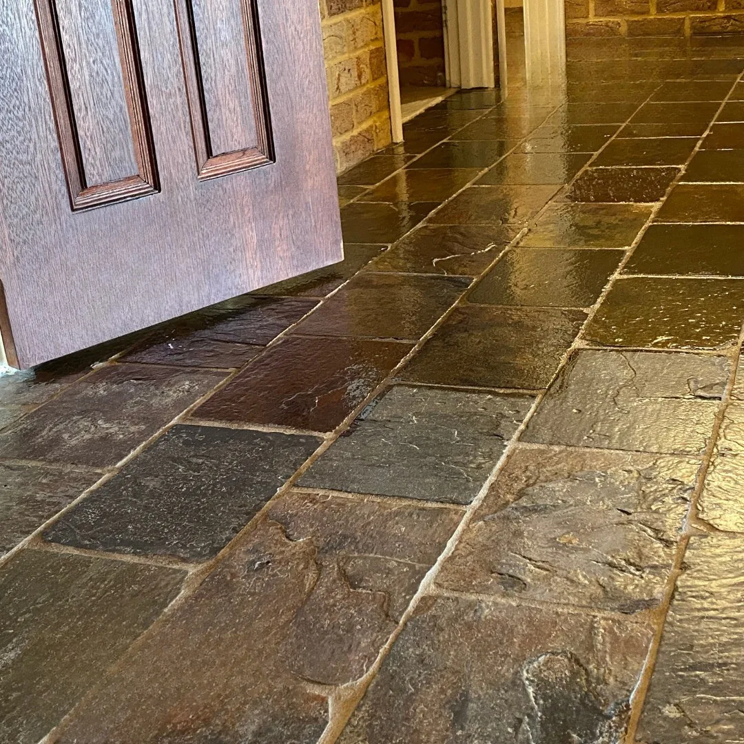 Before and after comparison of a natural stone floor